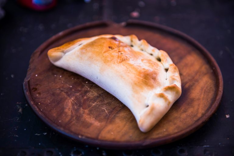 An empanada, a traditional Chilean food, Valparaiso, Valparaiso Province, Chile, South America