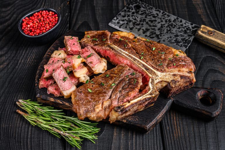 Sliced and roast T-bone or porterhouse beef meat Steak for steakhouse menu.