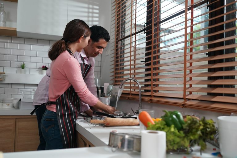 Asian house wife are cooking baking pastry or pie at home.