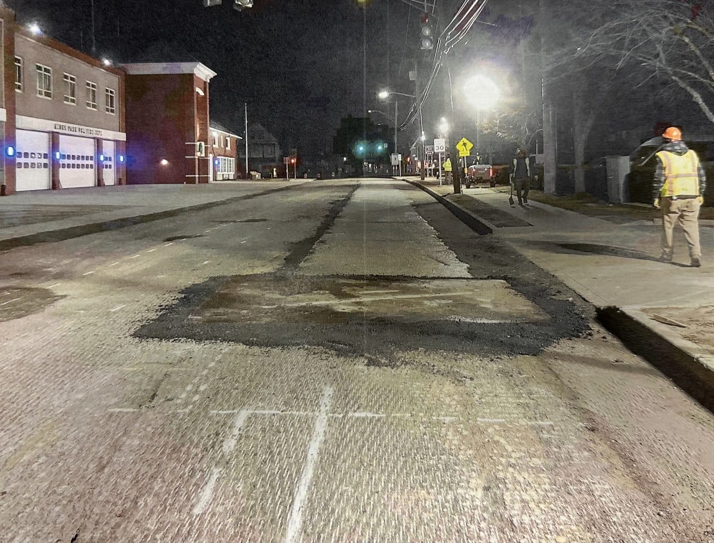 Huntington Station Sewer Project Details and Estimated Timeline - Metal plate with temporary asphalt.