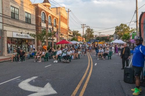 Summer In The Streets Aug 14th: Wall Street, Huntington Village, NY with Vendors and a crowd of attendees.