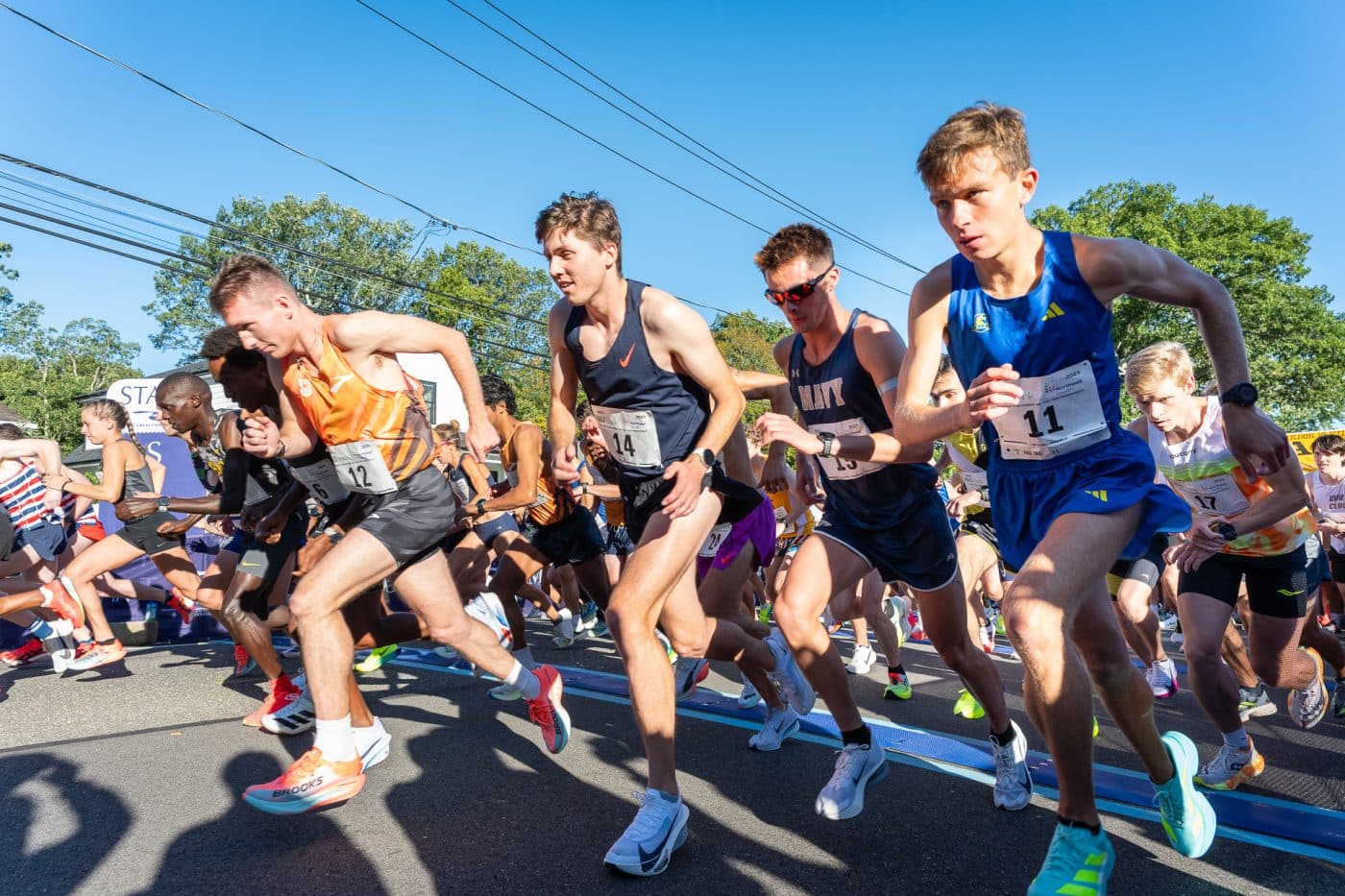 The Great Cow Harbor 10K Run 2025: Elite runners in the first wave take off from the starting line.