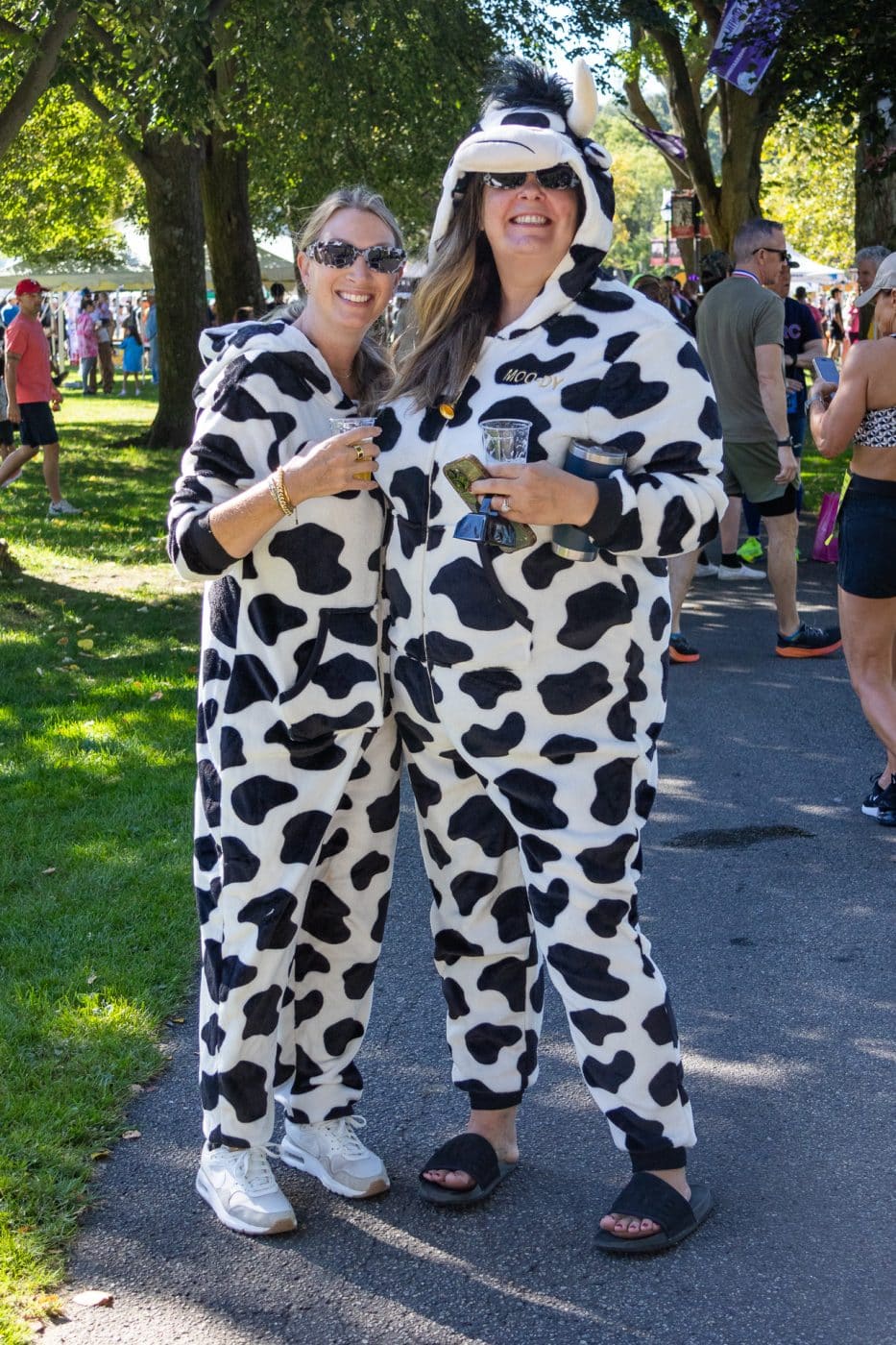 The Great Cow Harbor 10K Run 2025: 2 women dressed as cows.