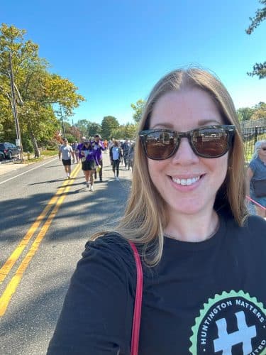 Huntington Wellness Recovery Walk - Megan, Huntington Matters, takes a selfie while walking with 100 others around Heckscher Park.