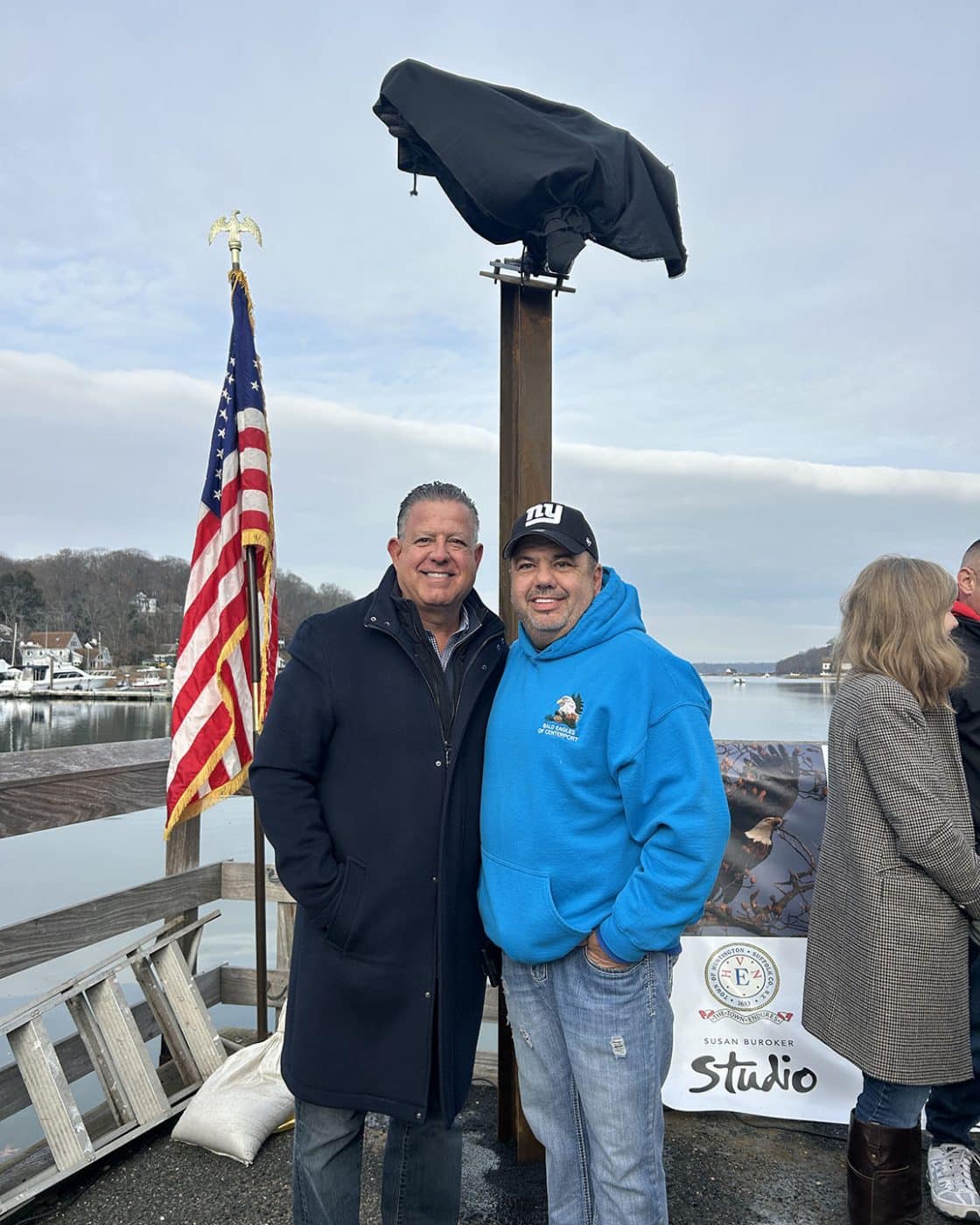 Councilman Sal Ferro and Robert Schwartz, Founder of Bald Eagles of Centerport underneath the covered statue. Unveiling Bald Eagles of Centerport Dad Eagle Statue