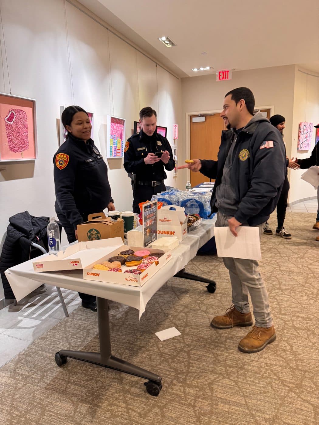 Suffolk County Police Department 2nd Precinct Community Liaison Officer Kat Licul serves refreshments. Suffolk County Police Department Recruitment Information Session
