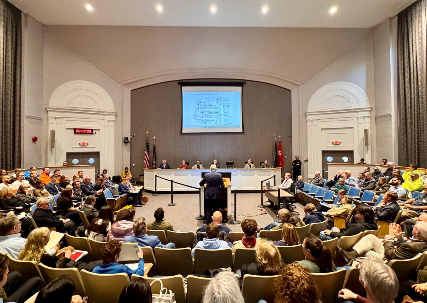 Rear view of Auditorium. Melville Crossing Public Hearing Draws Strong Reactions