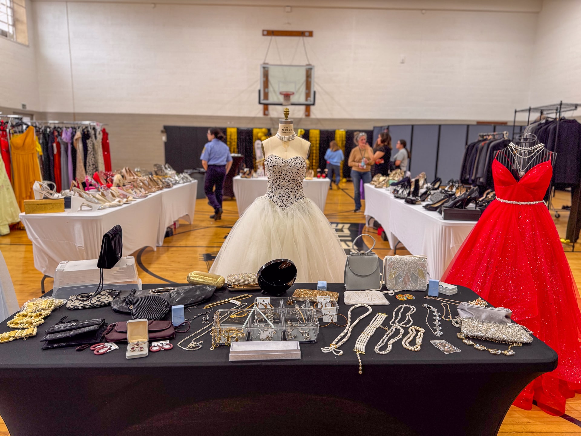 The hours of work by the Town, Youth Bureau, SCPD 2nd Precinct, and volunteers are evident in every detail, transforming the space into a boutique-style showroom filled entirely with community-donated dresses, suits, and accessories for students preparing for prom. Project Prom Transforms Huntington Senior Center into a Prom Boutique