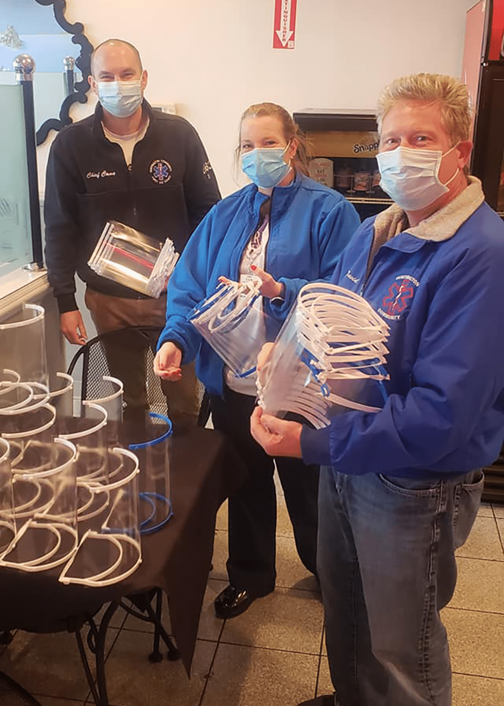 Huntington Community First Aid Squad first responders picking up free face shields made by Edmund Zarou. Zaro’s Cafe Closing After More Than 30 Years in Huntington Station