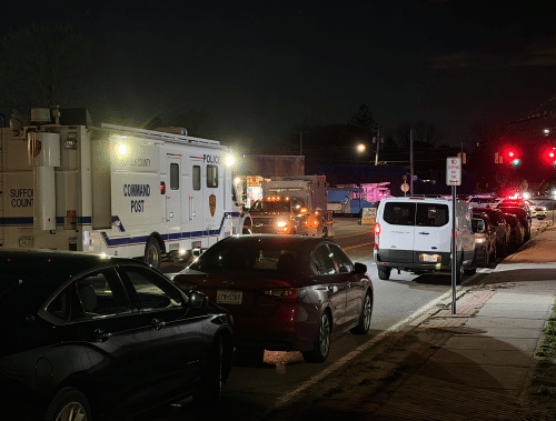 The Suffolk County Police Department Command Post truck and other Police vehicles parked outside of the One Stop Deli and Gyro on Pulaski Road in Huntington Station. One Person Killed in Targeted Huntington Station Shooting