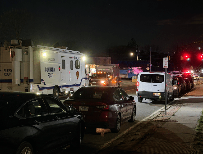 The Suffolk County Police Department Command Post truck and other Police vehicles parked outside of the One Stop Deli and Gyro on Pulaski Road in Huntington Station. One Person Killed in Targeted Huntington Station Shooting