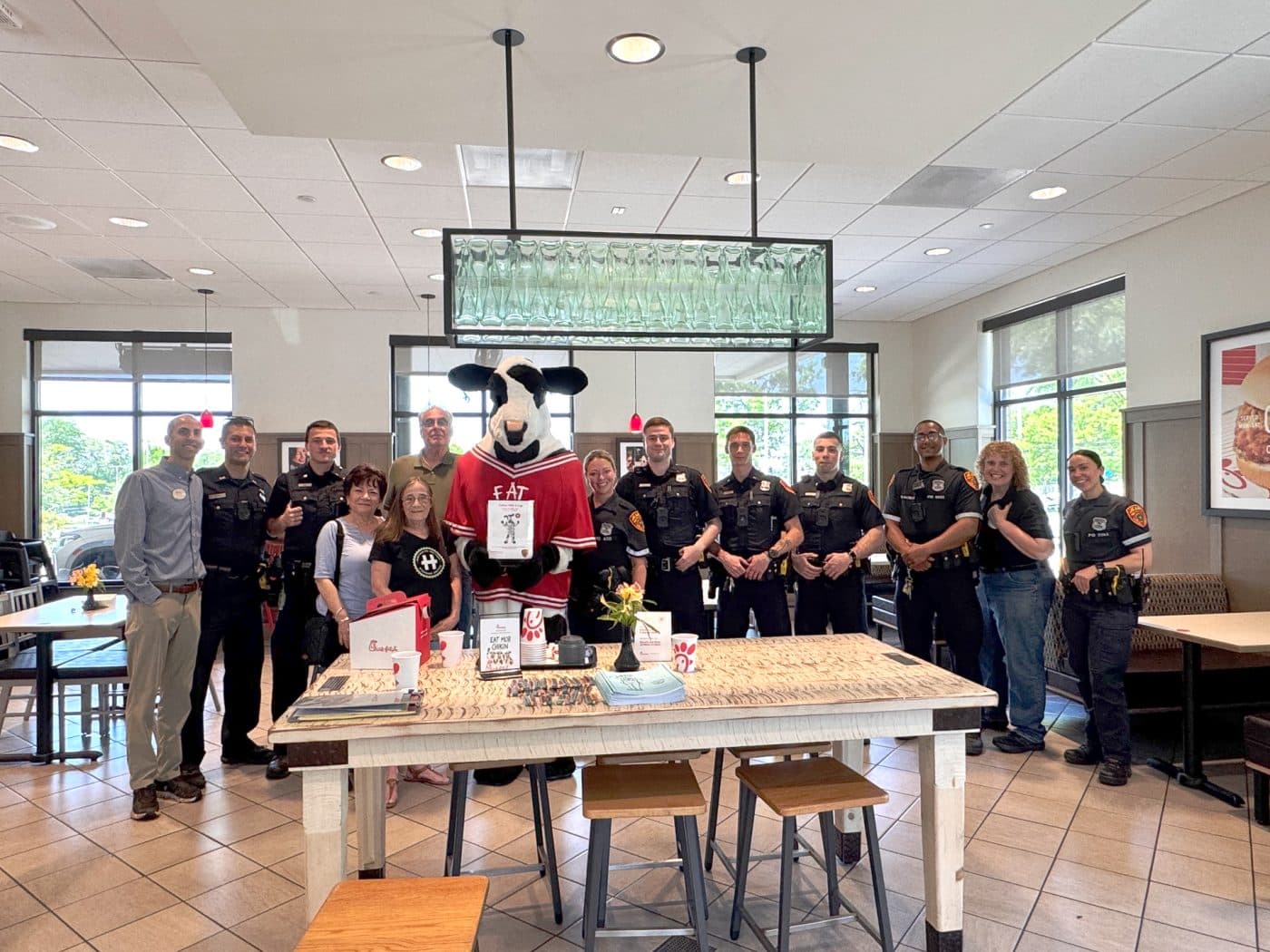 Chick-fil-A Manager (left) with SCPD 2nd Precinct PLAB members Denise & Vincent, Diane Schaber - Huntington Matters, Cow mascot, COPE Officer Jaime Wustenhoff with fellow Suffolk County Police Department Officers, Dana Richter - Huntington Matters & SCPD 2nd Precinct PLAB with 2nd Precinct School Resource Officer Brittany Ciaramitaro. Coffee, Conversation and Community at Chick-fil-A
