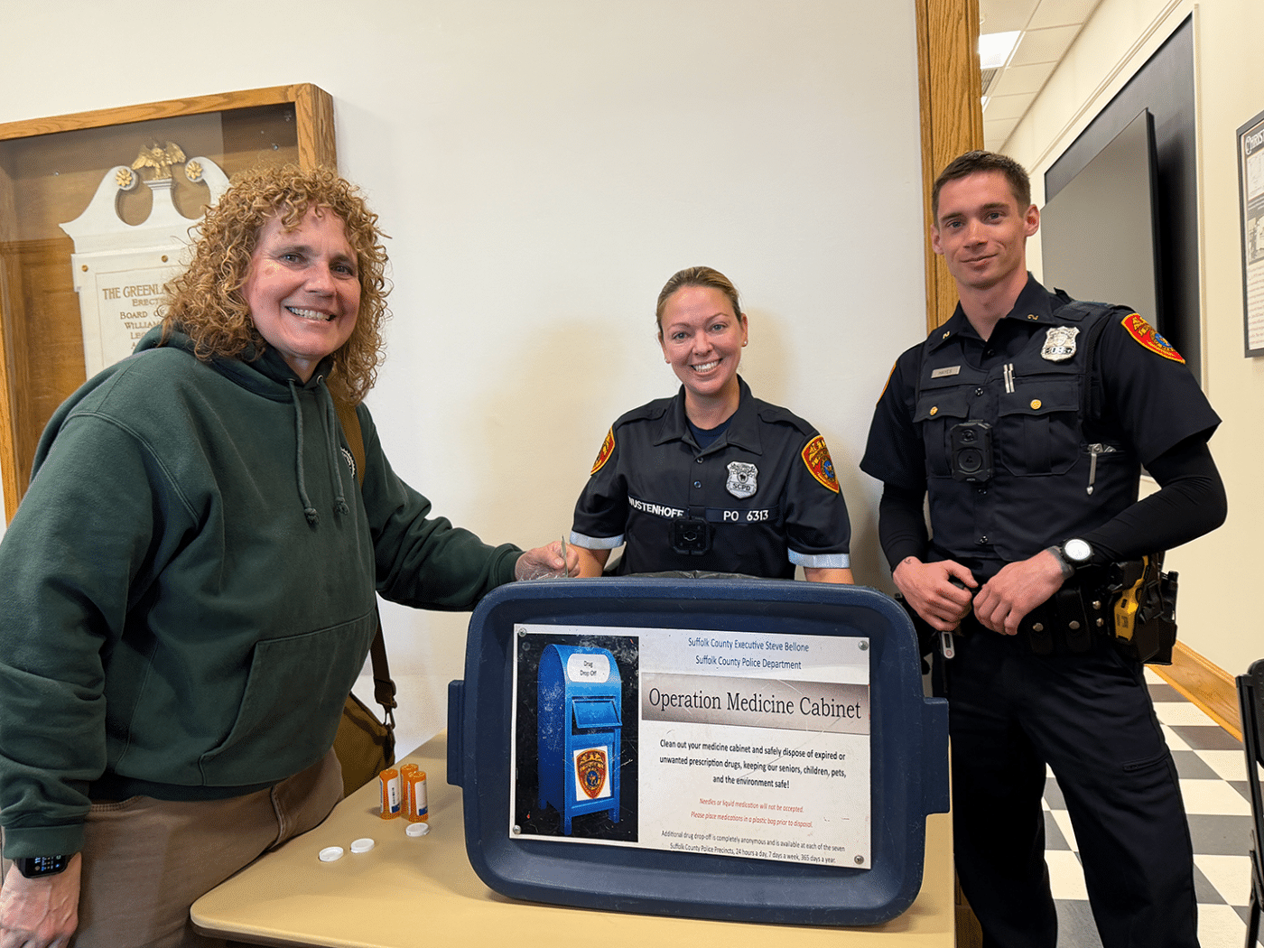 Dana Richter - Huntington Matters drops off expired medication with SCPD COPE Officer Wustenhoff at Operation Medicine Cabinet. May 2026 Suffolk County Police Department 2nd Precinct Community Meeting