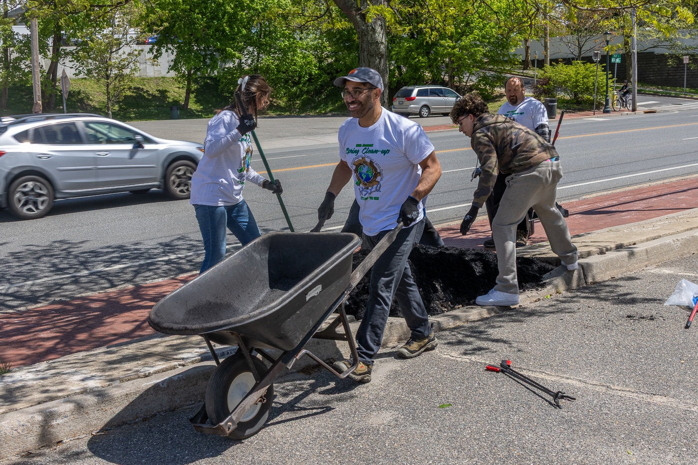 The Route 3 volunteers work with Quality Island Landscaping to clean and mulch the trees along the LIRR commuter parking lot. Laura Palacios (with rake) and Xavier Palacios (with wheelbarrow) started Friends of Huntington Station Latin Quarter 17 years ago, co-hosting the Spring Cleanup for 16 years. Working together with volunteers. Huntington Station Latin Quarter and Huntington Matters Host 16th Annual Spring Cleanup