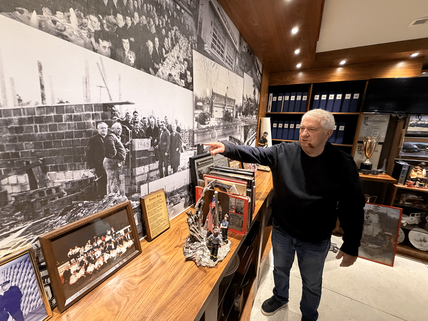 Veteran Firefighter Frank Mongelli, Melville Fire Department gives a tour of the Department's History Museum. A Community Within the Community: The Volunteer Firefighters and EMTs of Huntington