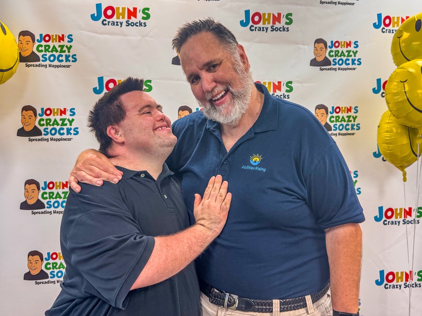 John's Crazy Socks co-founders John Cronin and Mark Cronin share a moment together during the grand opening celebration. John's Crazy Socks Opens First Retail Store in Huntington Village