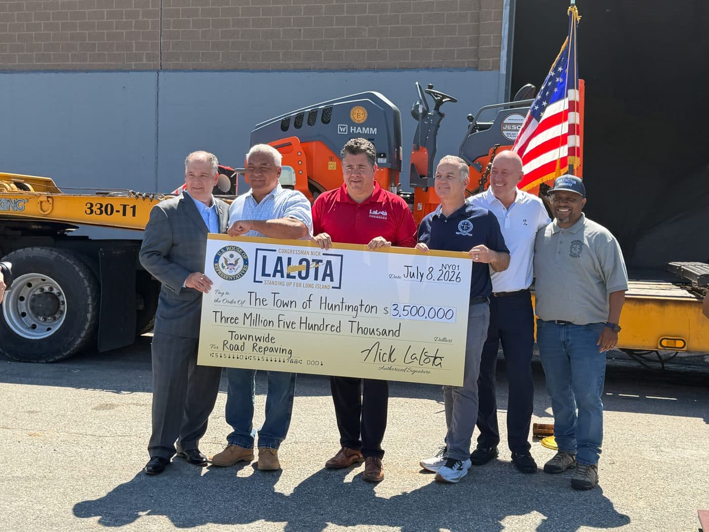 New York State Senator Mario Mattera, Huntington Superintendent of Highways Andre Sorrentino, Congressman Nick LaLota, Town of Huntington Supervisor Ed Smyth, Deputy Superintendents of Highways George Schwertl and Walter Edwards. Huntington Receives $3.5M Federal Grant for Road Paving
