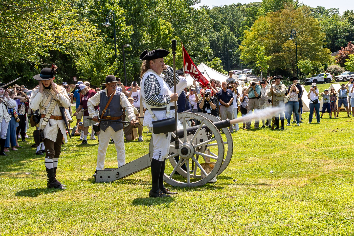 The Order of the Ancient and Honorable Huntington Militia fires the cannon on the Village Green. Huntington Recreates July 22, 1776 During America's 250th Celebration