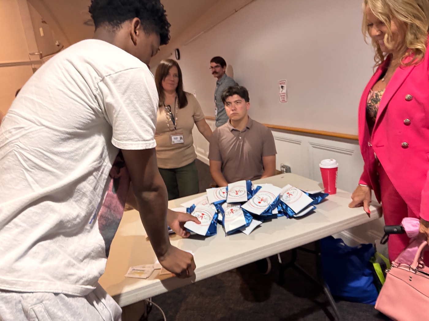 Students collect their naloxone kits after the training - with Coucilwoman Theresa Mari. Naloxone Saves Lives: Youth Bureau Leads Overdose-Response Training Amid Summer Risk