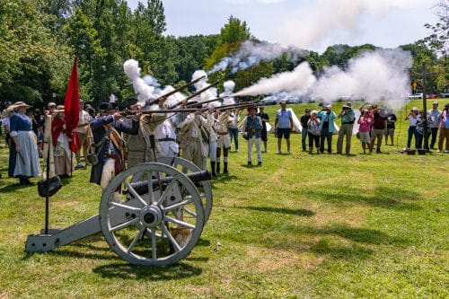 The Order of the Ancient and Honorable Huntington Militia fires their muskets on command. Huntington Recreates July 22, 1776 During America's 250th Celebration