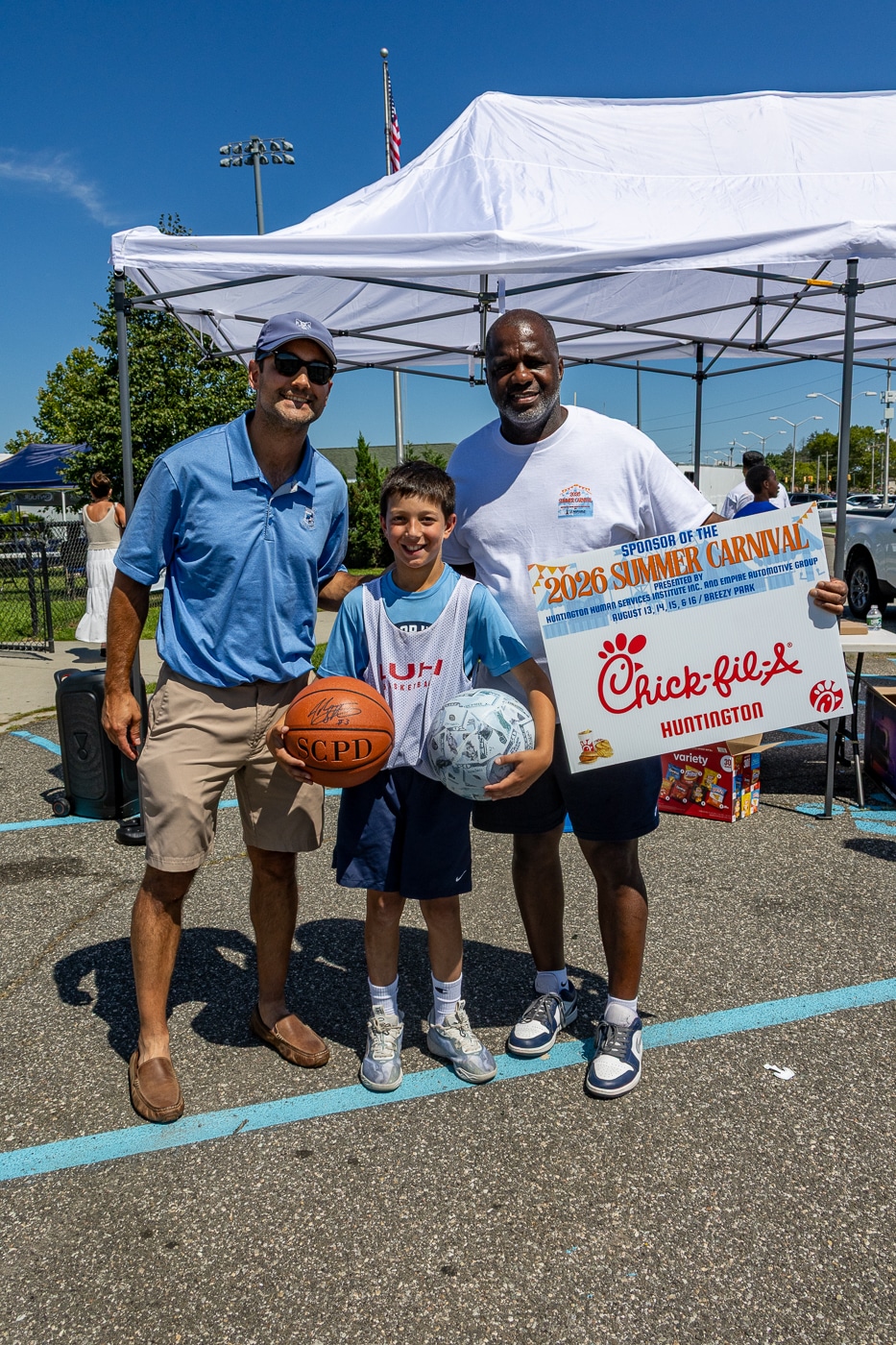 Spencer Panek won the 3-Point Shooting Contest for his age group AND Free Chick-fil-A for a year! With his proud father John Panek (left) and event organizer Huntington's Director of Human Services Kevin Thorbourne. Young Athletes Take the Court at Breezy Park Basketball Tournament