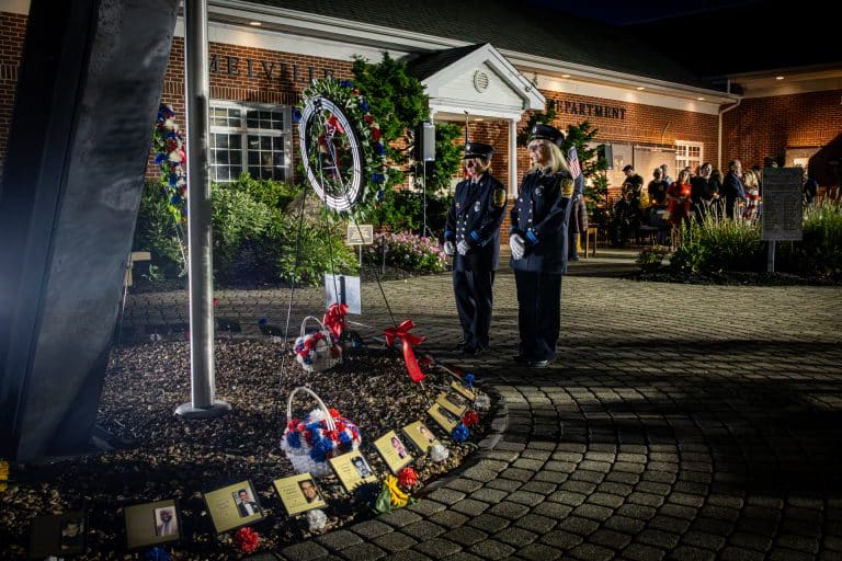 Melville Fire Department volunteers pay their respects. Photo Stories: Melville Gathers by Candlelight to Remember September 11