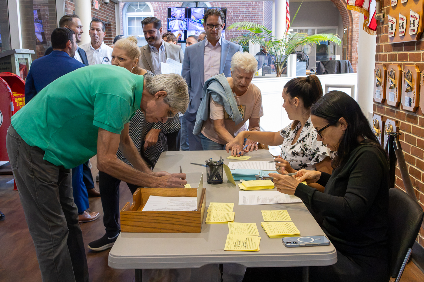 Residents sign up to speak at the Town Board meeting. Huntington Town Board Tackles Six Hearings, Tax Cap Override