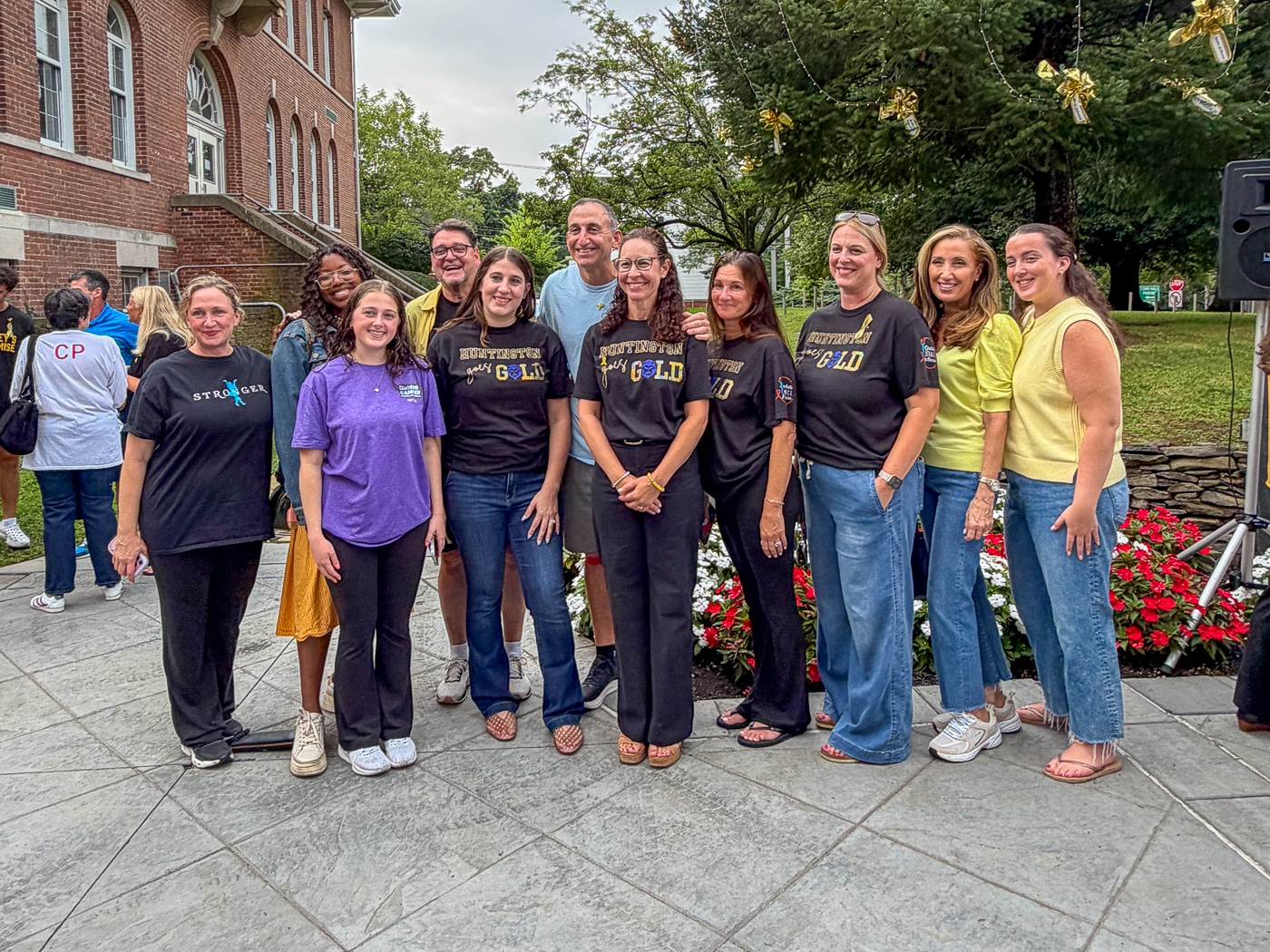 Rachel Antorino's mother Aimee (center front) gathered with family and supporters in Rachel's memory. Huntington Goes Gold: Tree Lighting Shines a Light on Childhood Cancer