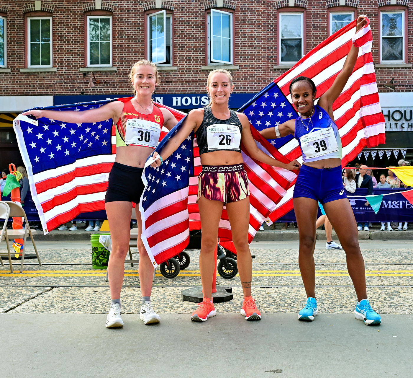 3rd-Place Women's Winner Eva Jess, 2nd-Place Women's Winner Kassie Parker, 1st-Place Women's Winner Biruktayit Degefa. The Great Cow Harbor 10K Run 2026 in Northport NY
