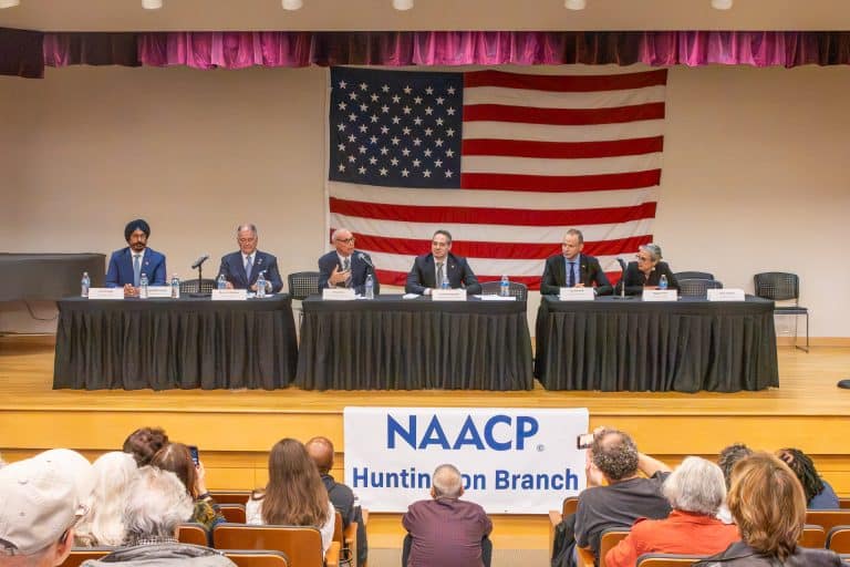 Candidates for Suffolk County and New York State seated at a long table on the stage. Photo Stories: 2026 NAACP Huntington Branch Meet the Candidates Night