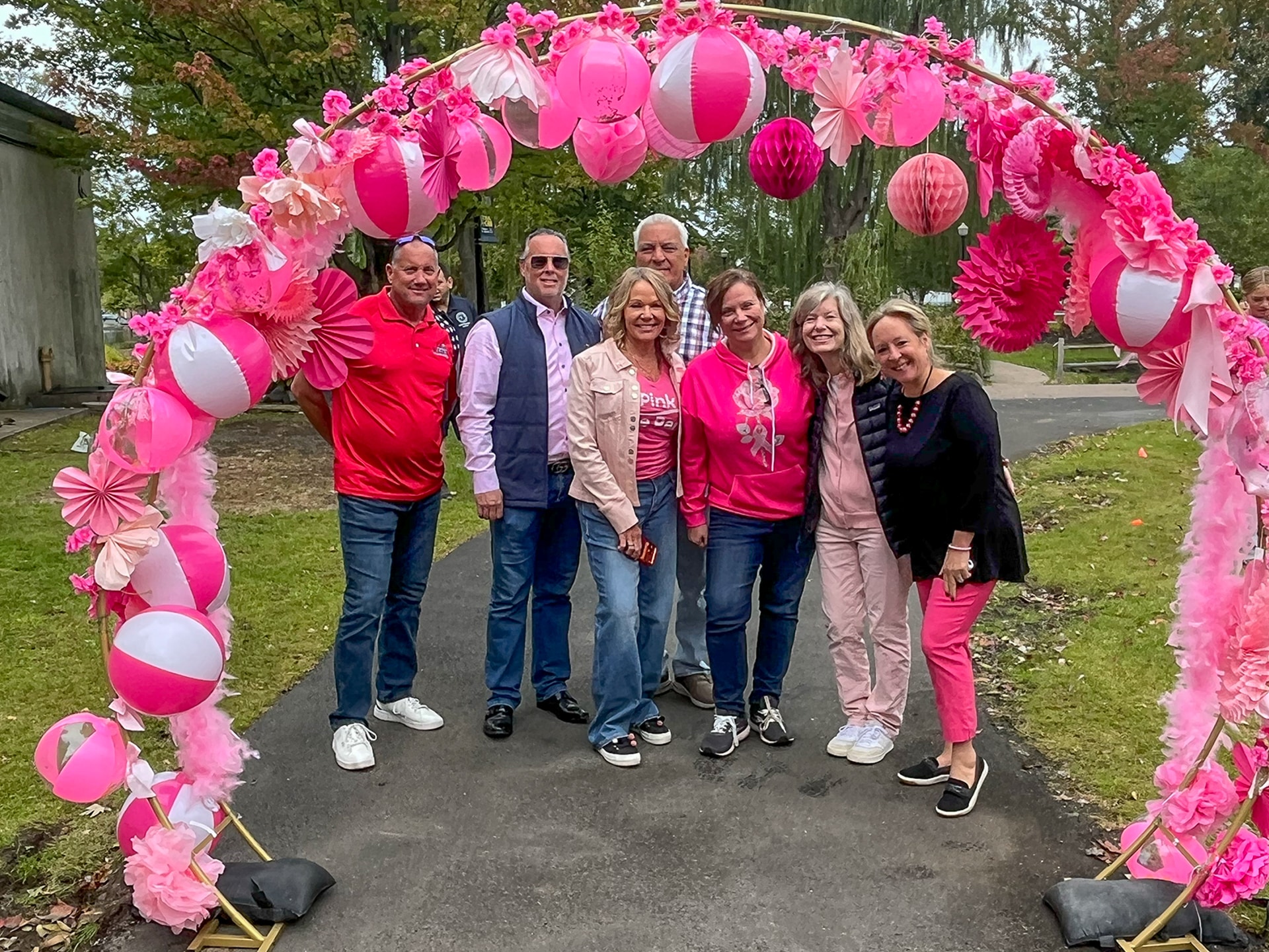 Kicking off the walk under the pink arch Candidate for NYS Assembly Dave Weber - Northport Trustee, Hon. Joshua Price, Breast Cancer Survivor Councilwoman Theresa Mari, Andre Sorrentino (checked shirt) - Huntington Superintendent of Highways, Michelle Wright - Councilwoman Mari's Legislative Aide, Councilwoman Jennifer Hebert and County Legislator Rebecca Sannin. Pink in the Park Brings Awareness, Hope and Support to Huntington